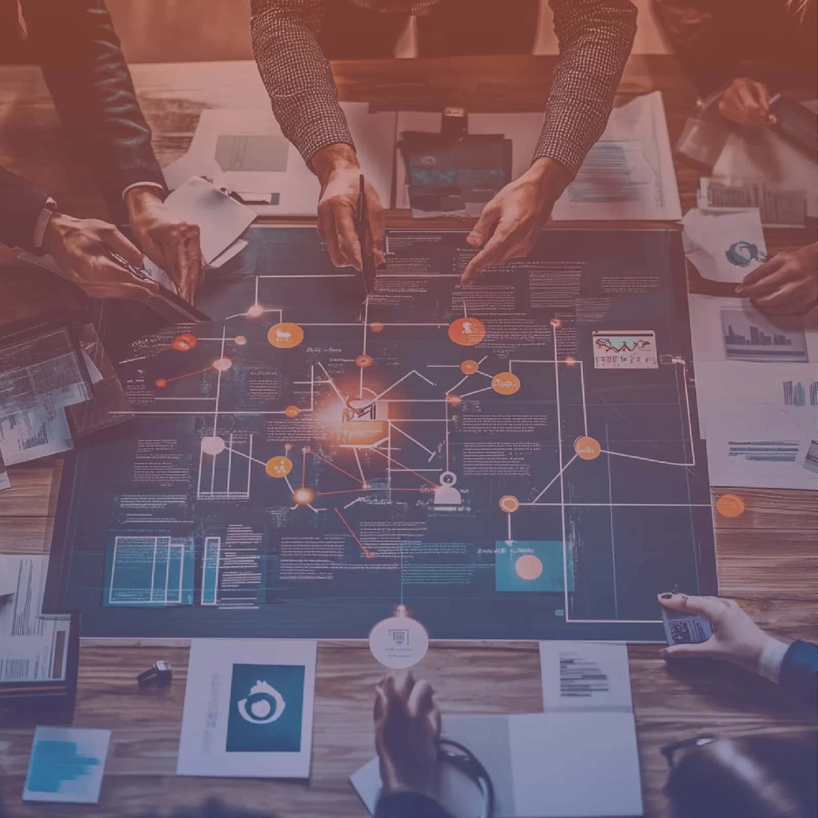 Team mapping a business workflow on a shared process diagram before automating it